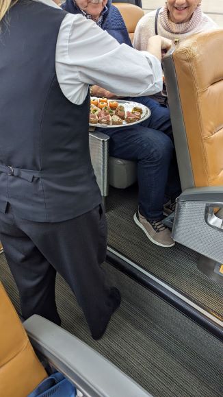 Hors d'oeuvres served with sparkling wine upon departure from Toronto